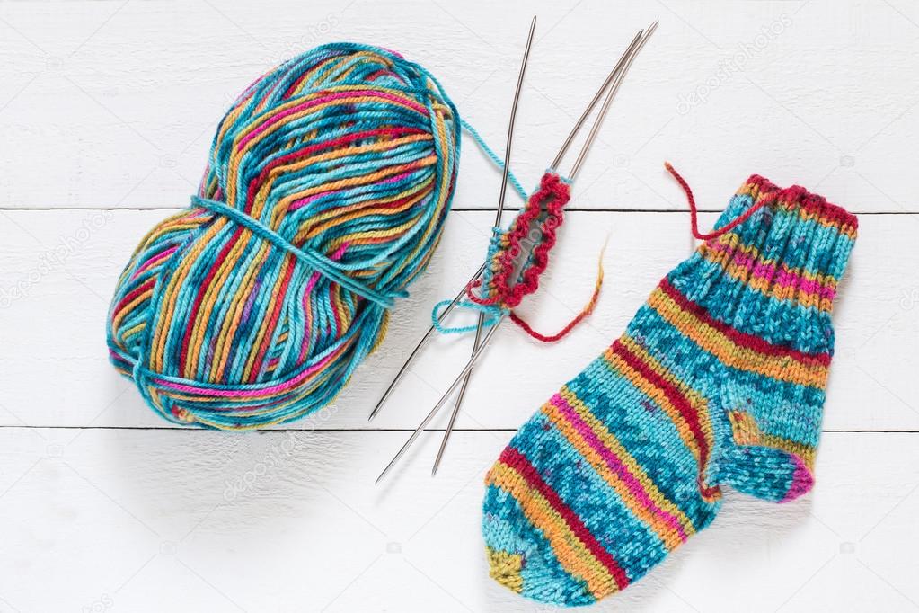 Variegated yarn, sock, needles with knitting Stock Photo by ©13-Smile  100951316